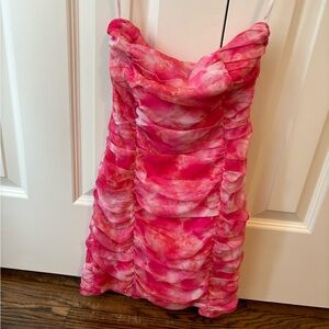 Strapless semi formal tie-dye mini, flattering gathers make up the bodice